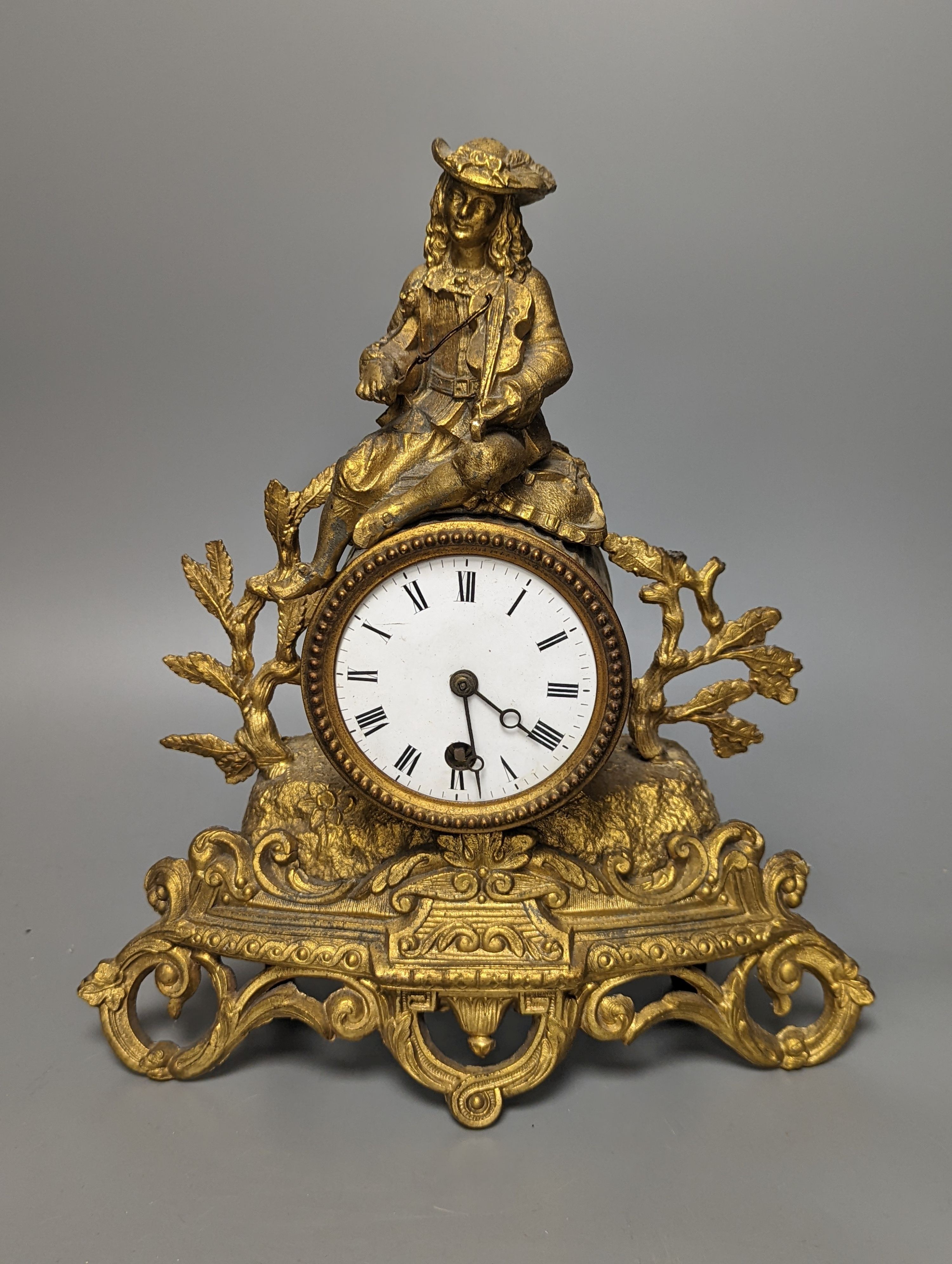 A 19th century French gilt spelter mantel timepiece, with pendulum, height 29cm